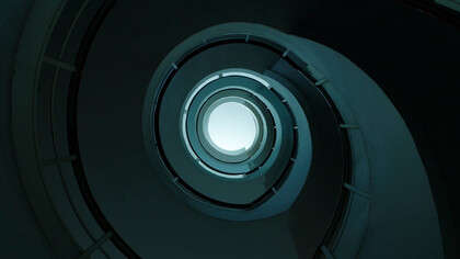 Like the spiral staircase, the pursuit of knowledge is an endless journey, where each step reveals new insights, pushing experts to continuously seek answers and challenge existing understanding