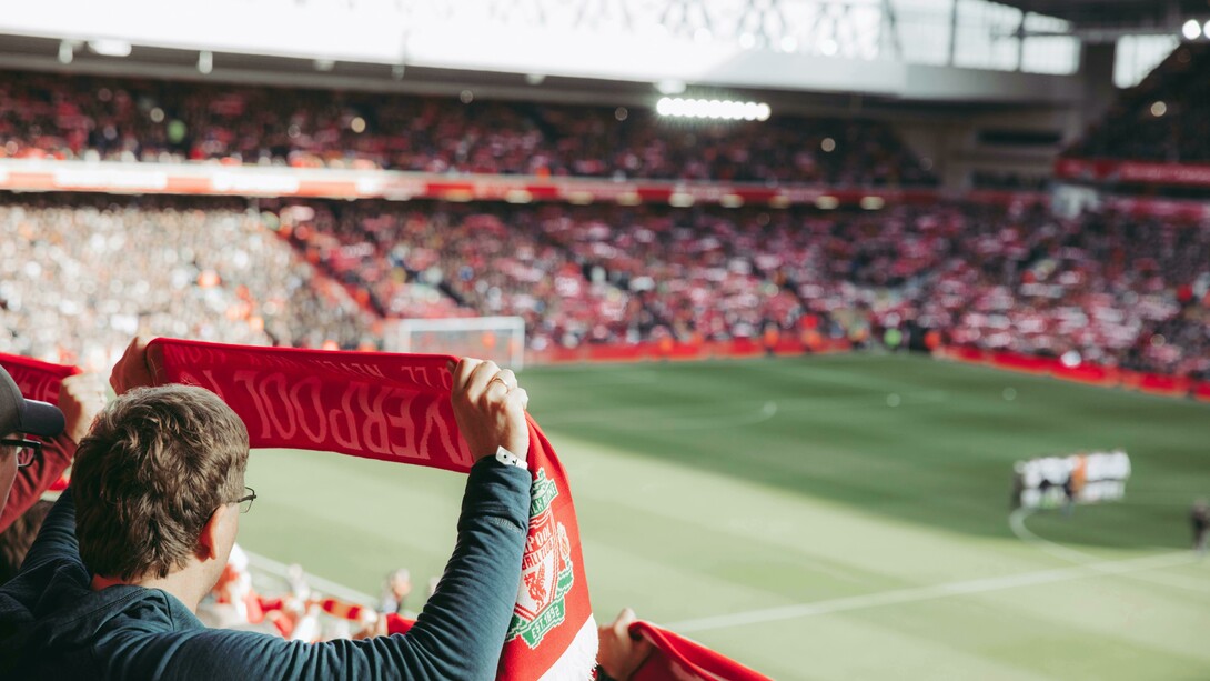 In Liverpool, England, United Kingdom, crowds gathered to watch the soccer game with passion and pride