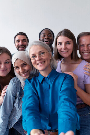 A cheerful assembly of individuals from various cultures taking a selfie together, reflecting the rich tapestry of cultural diversity in our interconnected world