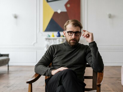 A therapist in his studio. Talk to a therapist if you need to have some guidance. Talking to a therapist will help you to decrease stress