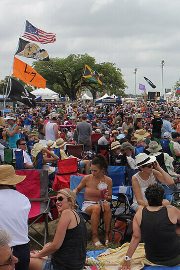 A vibrant crowd gathered at the New Orleans Jazz Fest 2017, immersed in the music, culture, and energy of the festival