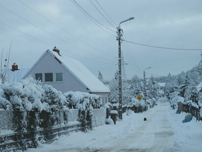 In the heart of winter, the quiet snow-covered paths and humble homes of rural Russia evoke a sense of peace and timelessness