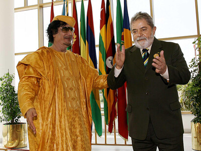 Sirte, Libya — Brazilian President Luiz Inácio Lula da Silva and Libyan leader Muammar Gaddafi attend the opening ceremony of the 13th Ordinary Session of the African Union Assembly