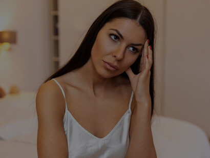 Young couple experiencing a relationship conflict at home, with the woman appearing frustrated and depressed