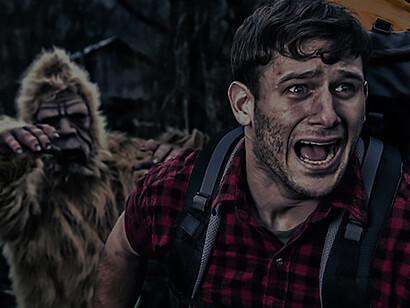 Exciting imagery showcasing Bigfoot in pursuit of a camper through the dense woods