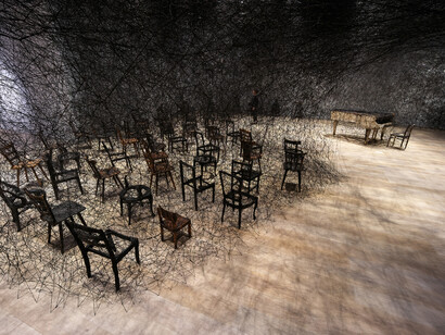 Shiota Chiharu, In Silence (detail), 2002/2019, Burnt piano, burnt chair, Alcantara black thread, Dimensions variable, Production support: Alcantara S.p.A., Courtesy: Kenji Taki Gallery, Nagoya/Tokyo, Installation view: Shiota Chiharu: The Soul Trembles, Mori Art Museum, Tokyo, 2019 © Sunhi Mang, Photo courtesy: Mori Art Museum, Tokyo