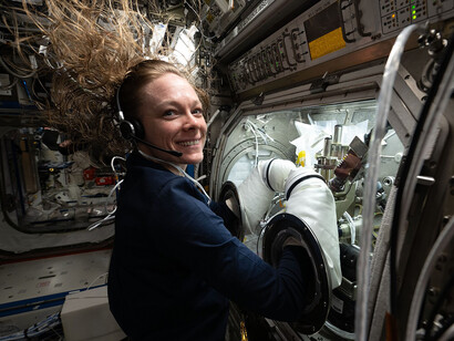 NASA astronaut and Expedition 73 Flight Engineer Nichole Ayers conducts research inside the Destiny laboratory module’s Microgravity Science Glovebox aboard the International Space Station. She swaps syringes containing protein samples and installs test cells for the Ring-Sheared Drop Interfacial Bioprocessing of Pharmaceuticals experiment, which uses surface tension to contain liquids and study proteins without contact with solid walls. The results may advance pharmaceutical manufacturing and 3D printing technologies both in space and on Earth