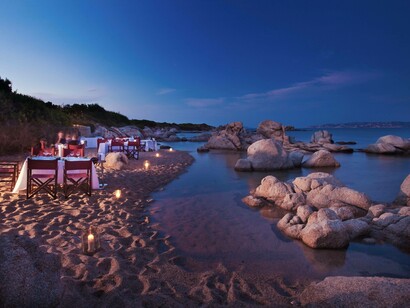 A night-time romantic beach setting at Valle dell’Erica in Northern Sardinia, Italy