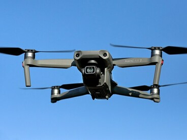 A DJI Mavic Air 2 drone captured mid-flight