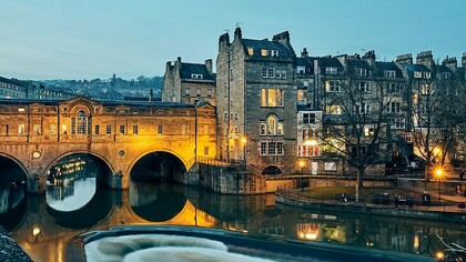Pulteney Bridge, spanning the River Avon in Bath, England, was completed in 1774 to connect the city with Bathwick, an area the Pulteney family sought to develop. Designed by Robert Adam, the bridge is a striking example of Palladian style