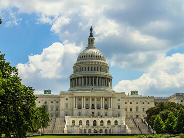The U.S. Capitol against a blue sky in Washington, D.C., U.S., representing the struggle over the future of democracy and the state