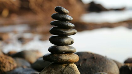 A serene stack of balanced stones symbolizes the art of focus and mindfulness