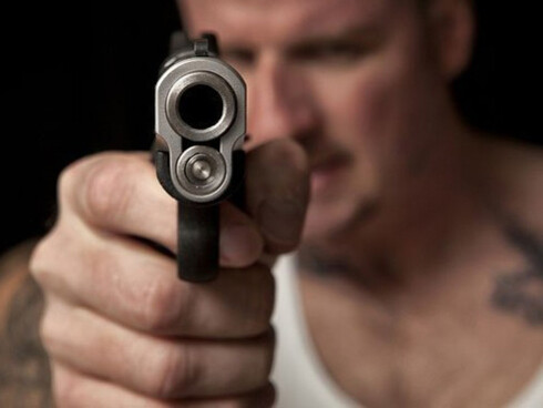 Man pointing a handgun