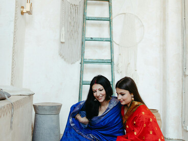 Women wearing traditional Indian Banarasi silk sarees