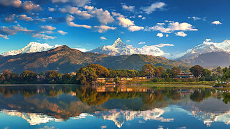 Annapurna mountain range reflected in Phew Lake at Pokhara, Nepal