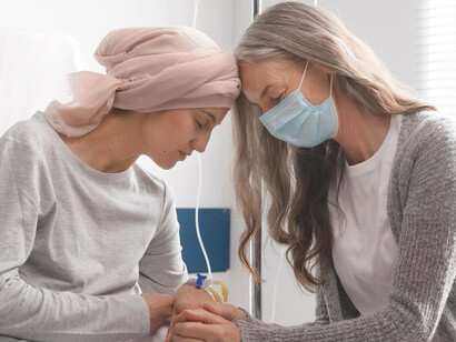 Inside the hospital, female cancer patients engage in heartfelt conversations