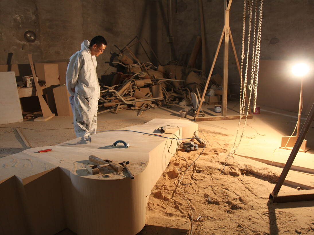 Wang Jianwei working at his Beijing studio, 2014. Photo: Xu Boxin, courtesy the artist. All works by Wang Jianwei © 2014 Wang Jianwei, used by permission.
