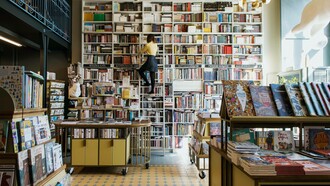 A person selecting their next novel to read