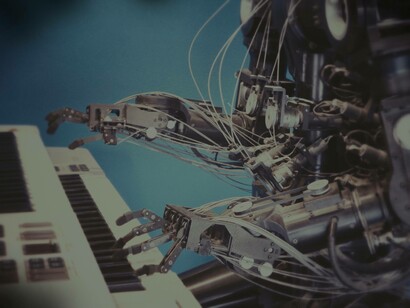 A Robot who is programmed to play music is demonstrating its skill on a keyboard