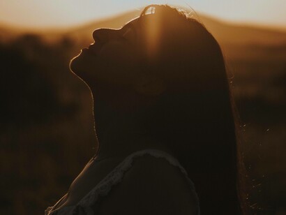 Head to sky feeling the breaths that are consuming the body in an attempt to reconnect with one's self in order to achieve self-love