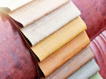 Samples of leather furniture upholstery in-store, featuring eco-friendly fabrics and vegan leather options that promote sustainable living and stylish design