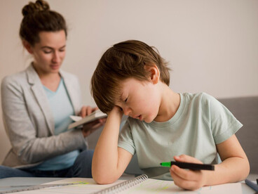 A child experiencing boredom while studying at home, illustrating how ADHD, fetal brain development, and nutritional epigenetics contribute to behavior patterns