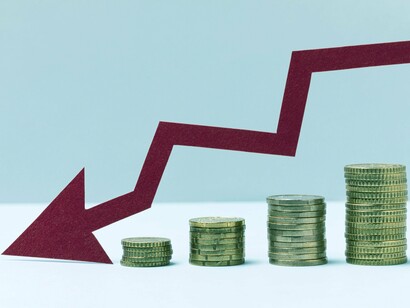 A red arrow changing course near stacks of coins depicts the unpredictable economic climate under Trump's policies