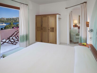 A look at one of the many elegant bedrooms at resort Cala di Falco in Cannigione, Italy