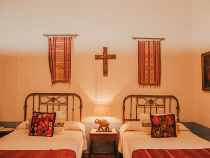 The room feels cozy, historic, and thoughtfully decorated, blending comfort with cultural character