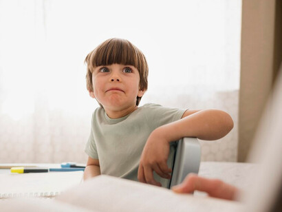 Child feeling bored at home while studying, highlighting the impact of ADHD on children, the importance of fetal brain development, and the role of nutritional epigenetics in shaping behavior