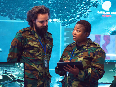 Military personnel monitoring live tactical data, reflecting the evolution of military readiness in the digital age