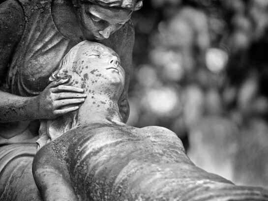Black-and-white image of a guardian angel statue in Montréal, Quebec, Canada