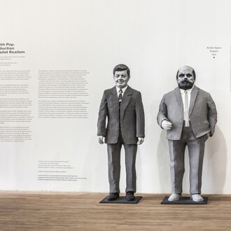 Installation view from Living with Pop. A Reproduction of Capitalist Realism, Artists Space, 2014. Reproductions of papier-mâché figures depicting John F. Kennedy and gallerist Alfred Schmela, originally exhibited at Leben mit Pop - Eine Demonstration für den kapitalistischen Realismus, 1963 / 2013 (Living with Pop – A Demonstration for Capitalist Realism)