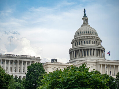 In Washington, D.C., the U.S. Capitol rests beneath drifting white clouds and a wide blue sky