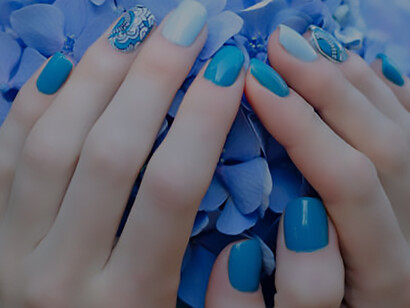 Discover elegance: Female hands with romantic manicured nails resting on peonies, adding sophistication to your look