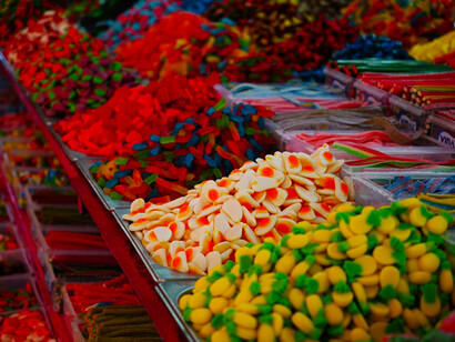 Rows of vibrant sweets are beautifully presented, inviting both children and adults to indulge