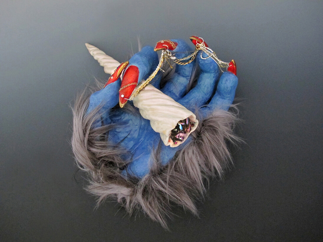 Roxanne Jackson, Legend
Ceramic, glaze, gold luster, chains, leather, iridescent crystals and gems, faux fur, 14 x 12 x 7 inches, 2015
