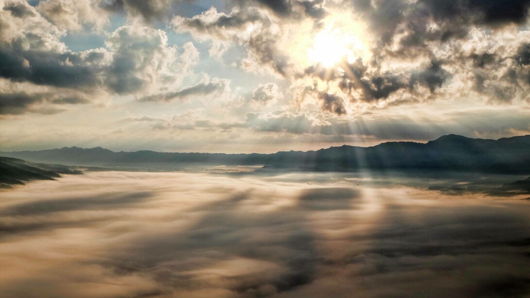 Light peering through the dark clouds