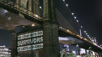 Sign on a bridge standing against caste violence in America