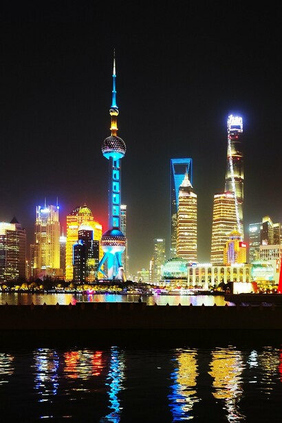 The dazzling lights of modern Shanghai contrast with the ancient figure of Akhenaten, now displayed in a city far removed from his time © Daniel Gauss