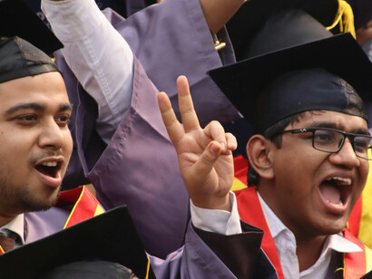 Joyful graduates celebrating at a university convocation in India