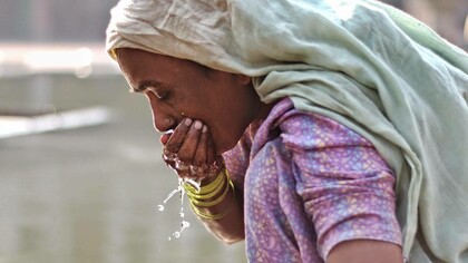 Woman washing her mouth