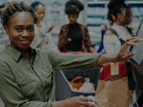 A woman shops for groceries in a cashierless, AI-powered store