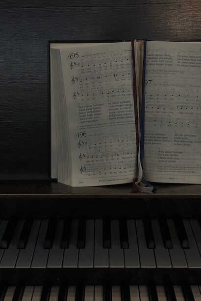 A grand piano adorned with elegant music sheets, harmoniously merging with the transformative vibrations of solfeggio frequencies, creating a symphony of healing and spiritual resonance