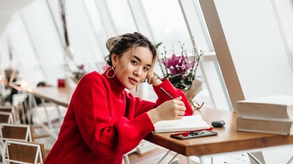A woman writing in her diary, representing the quiet rebellion of self-expression