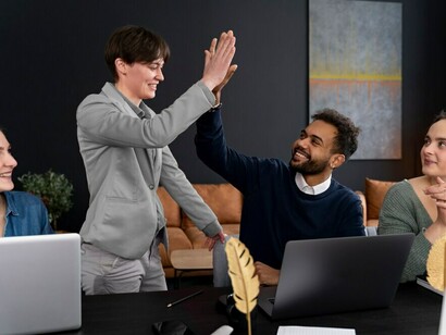 A person collaborating with colleagues in an office, highlighting the importance of diverse personality types, teamwork, and effective collaboration