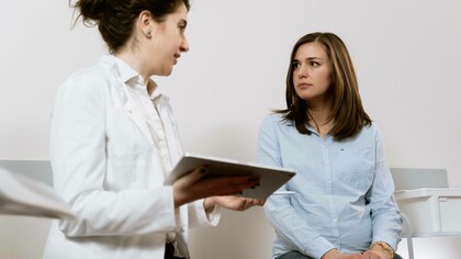 A doctor consulting their patient regarding their PCOS diagnosis