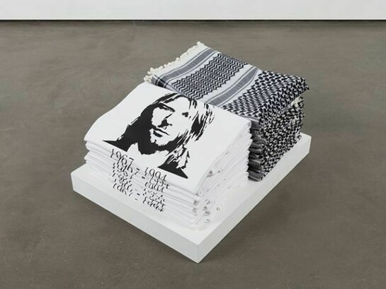 Emily Jacir, Bethlehem street corner  1998, 10 keffiyehs, 10 Cobain t-shirts, 6 1/2 x 17 1/2 x 13 in/16.5 x 44.5 x 33 cm