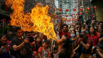 Dragon dancers celebrate in Manila Philippines, on Jan 25,  ph. Jes Aznar-Getty Images