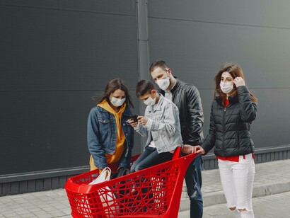 A family all agreeing to wear masks on outings like going to the supermarket